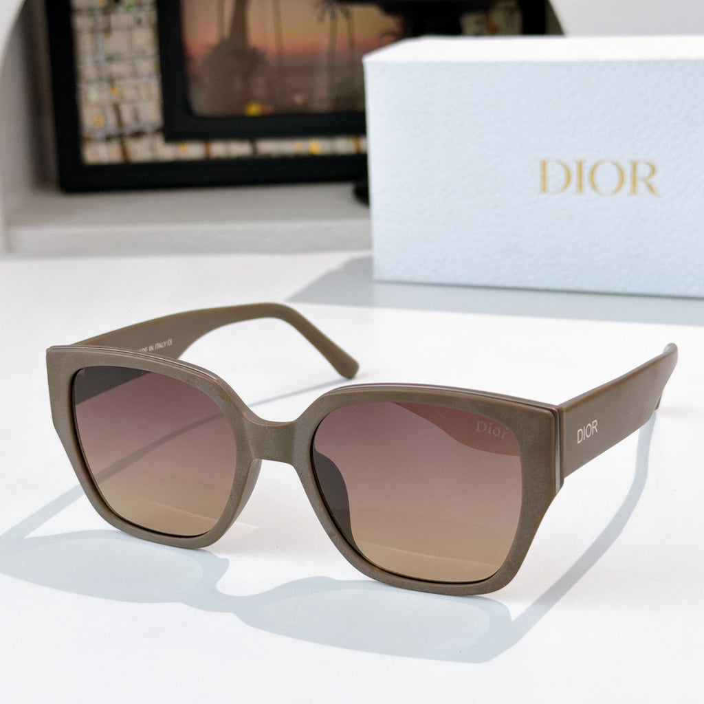 Dior sunglasses with dark olive frames and tinted pink lenses
