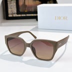 Dior sunglasses with dark olive frames and tinted pink lenses