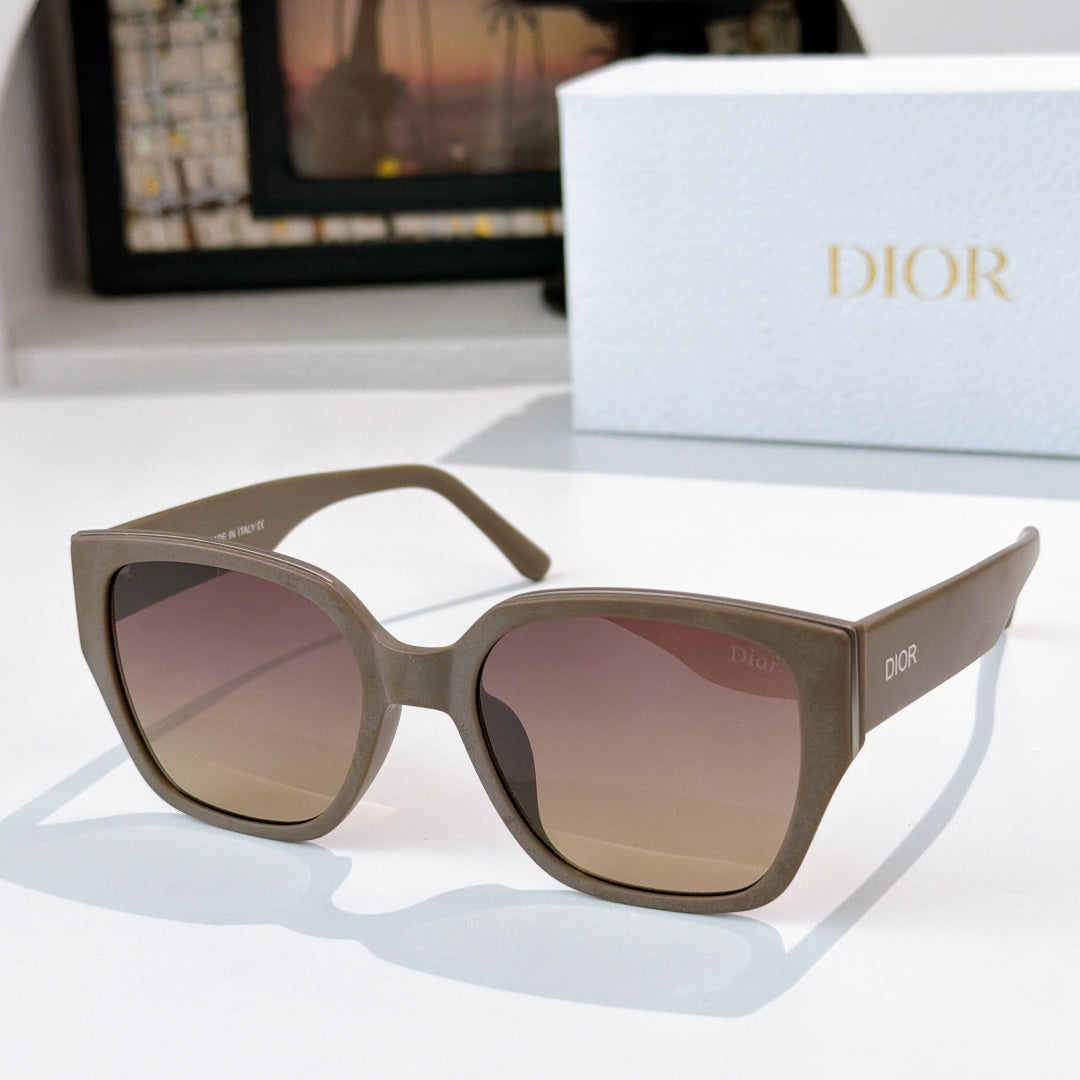 Dior sunglasses with dark olive frames and tinted pink lenses