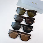 Stack of sunglasses with several frame colors and tinted lenses