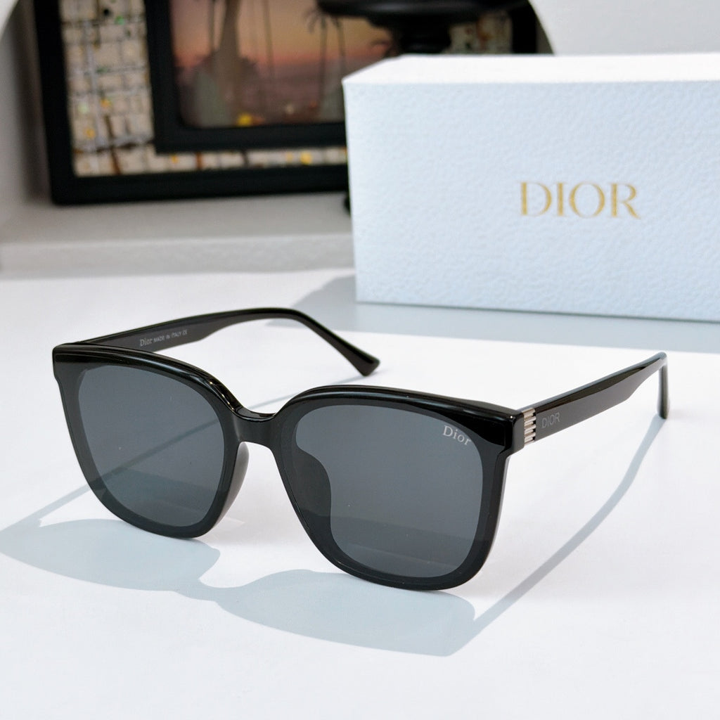 Sunglasses with black frame and gray-tinted lenses