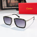 Black sunglasses with dark purple lenses, rectangular frames with gold accents.