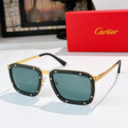 Gold-and-black sunglasses with teal lenses, rectangular frames and rivet studs.