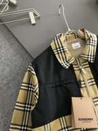 Plaid long-sleeve jacket with black body, zip front, and hanging tag at chest.