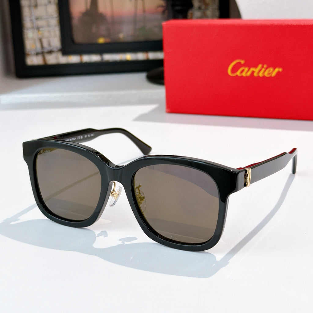Black cat-eye sunglasses with gray lenses and gold hinge detail