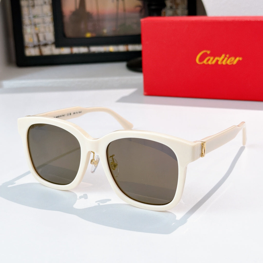 White cat-eye sunglasses with dark gray lenses and gold details