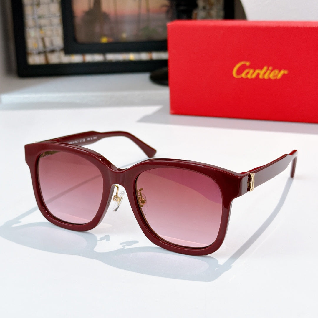 Burgundy cat-eye sunglasses with pink lenses and gold hinges