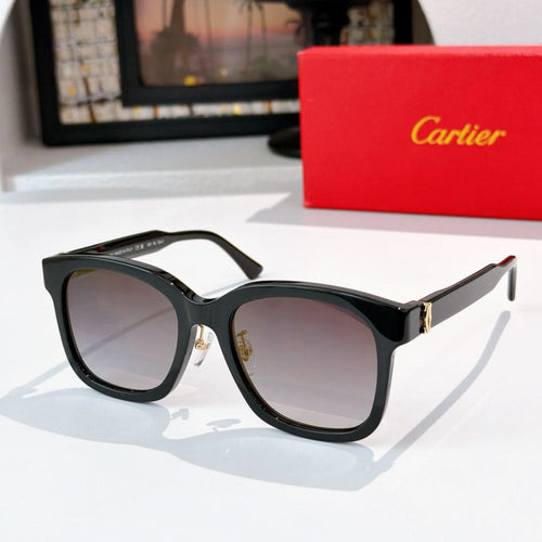 Black cat-eye sunglasses with gray lenses and gold hinges