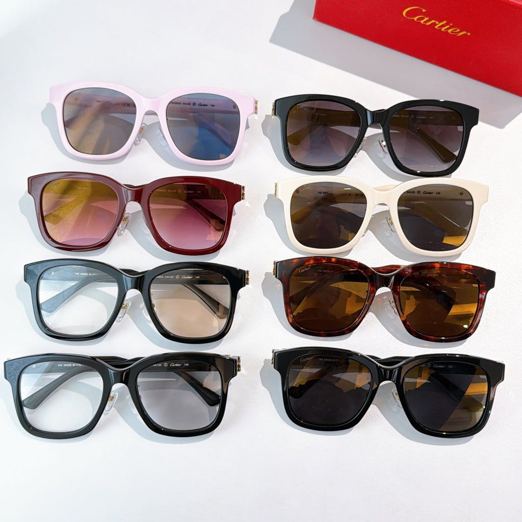 Assorted cat-eye sunglasses with tinted lenses in pink, black, blue, and brown