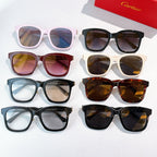 Assorted cat-eye sunglasses with tinted lenses in pink, black, blue, and brown