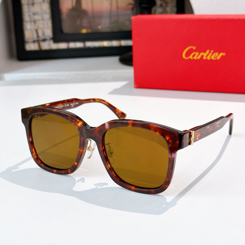 Tortoiseshell cat-eye sunglasses with amber lenses and gold hinges