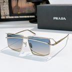 Gold metal sunglasses with light blue tinted rectangular lenses