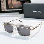 Silver metal sunglasses with dark gray tinted rectangular lenses