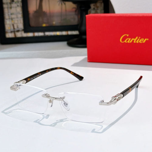Rectangular eyeglasses with dark tortoise frames and gold-tone details, clear lenses
