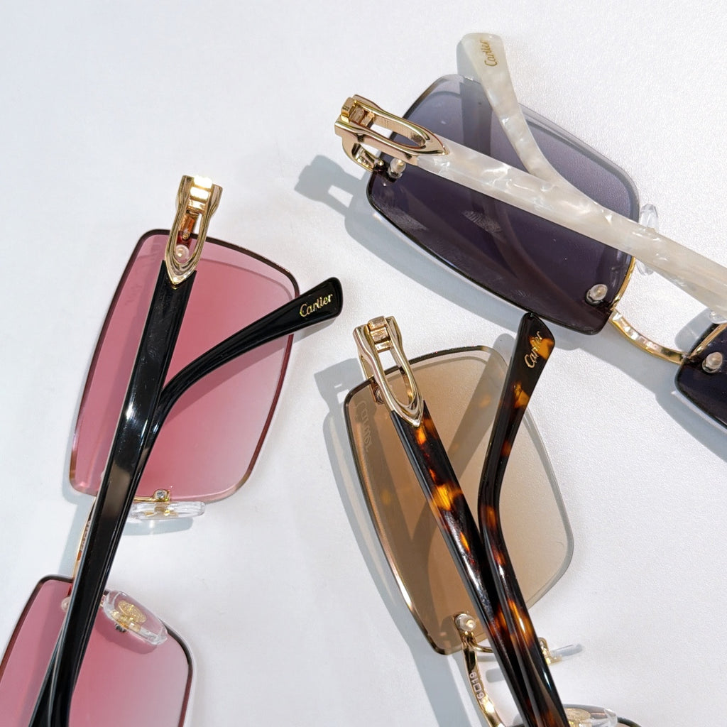 Square eyeglasses set with rose, tortoise, and dark-lens frames; gold-tone accents