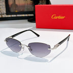 Cartier sunglasses with black frames and bluish tinted lenses with gold metal details