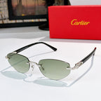Cartier sunglasses with black frames, green tinted lenses, and gold metal details
