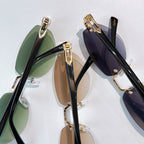 Cartier sunglasses close-up with green and dark lenses, gold metal frames
