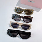 MiuMiu sunglasses assortment with four cat-eye frames in olive, brown, cream, and black