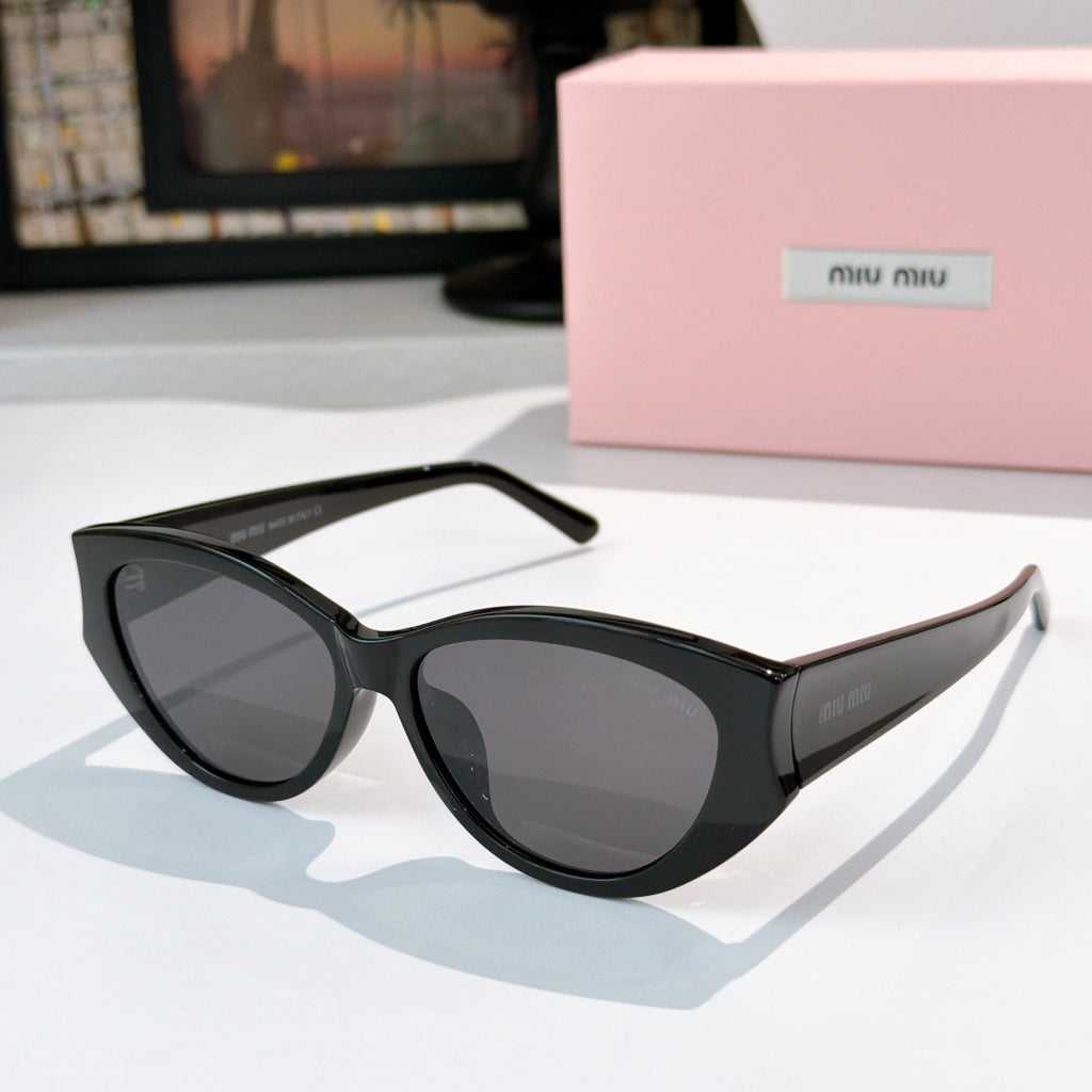MiuMiu cat-eye sunglasses with smoky lenses and black acetate frame