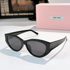 MiuMiu cat-eye sunglasses with smoky lenses and black acetate frame