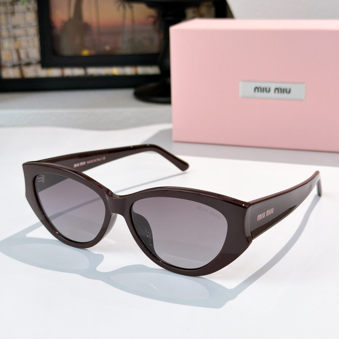 MiuMiu cat-eye sunglasses with dark lenses and dark brown acetate frame