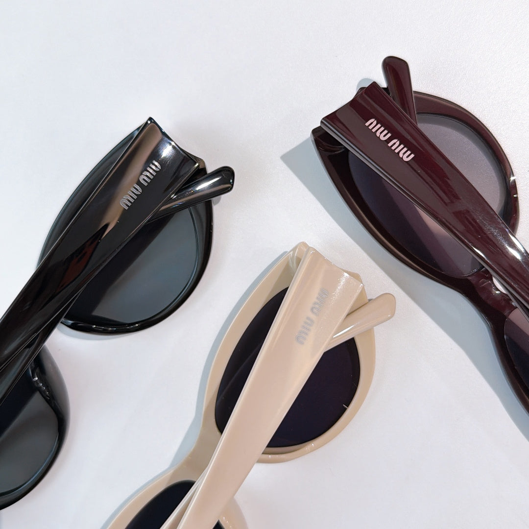 MiuMiu sunglasses set with black, cream, and burgundy cat-eye frames