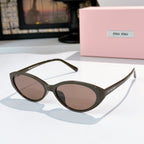 MiuMiu sunglasses with dark green frames and brown-tinted lenses
