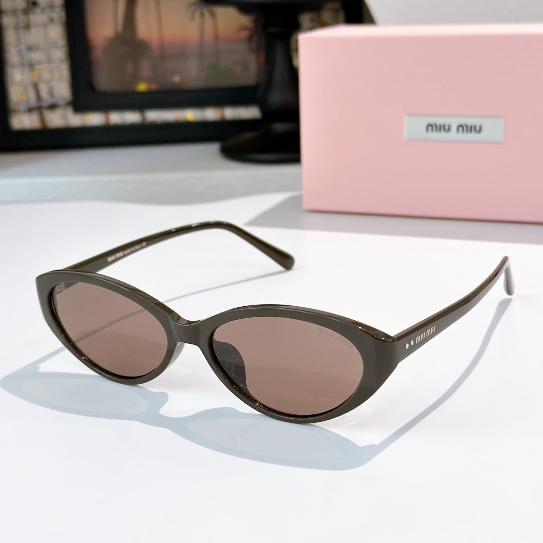 MiuMiu sunglasses with dark green frames and brown-tinted lenses