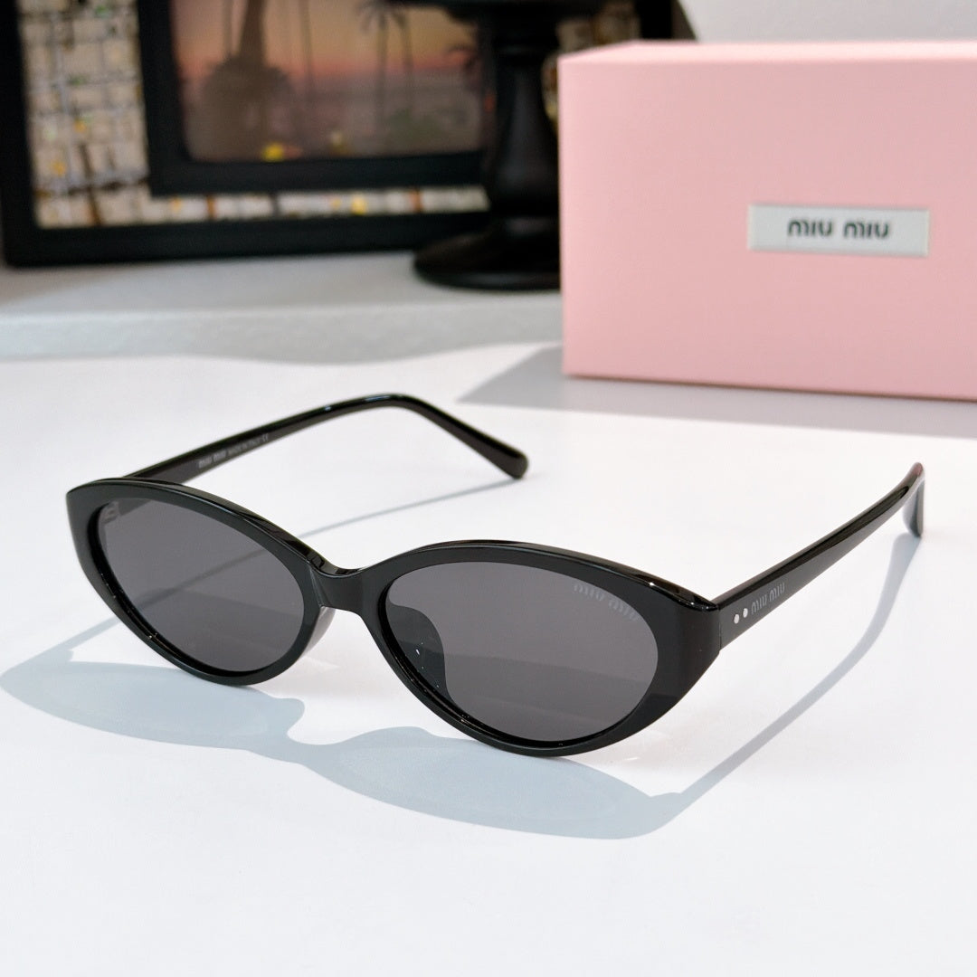 MiuMiu sunglasses with black frames and dark brown-tinted lenses