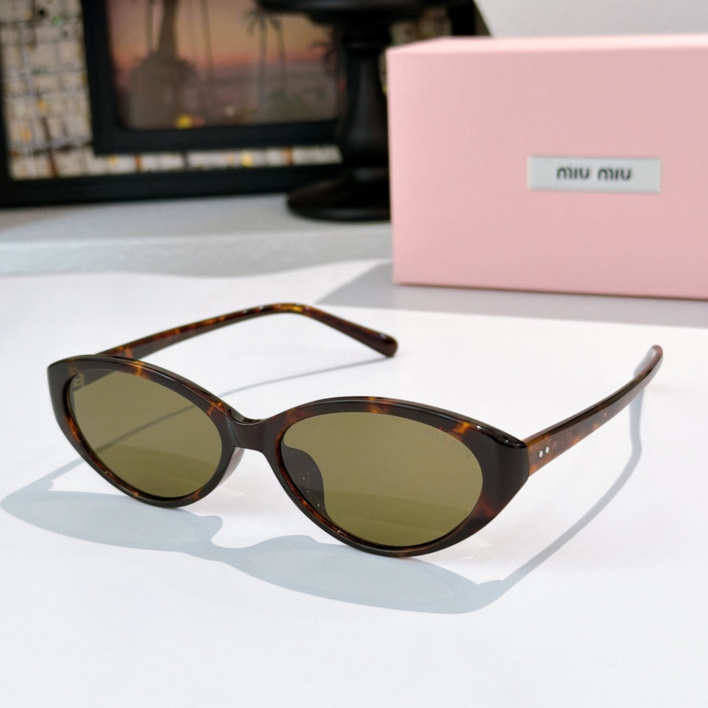 MiuMiu sunglasses with tortoiseshell frames and olive-tinted lenses