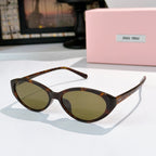 MiuMiu sunglasses with tortoiseshell frames and olive-tinted lenses