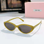 MiuMiu sunglasses with yellow frames and dark lenses