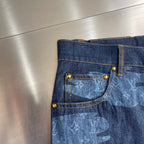 Louis Vuitton dark blue denim shorts with gold-tone buttons and light blue patterned back pocket