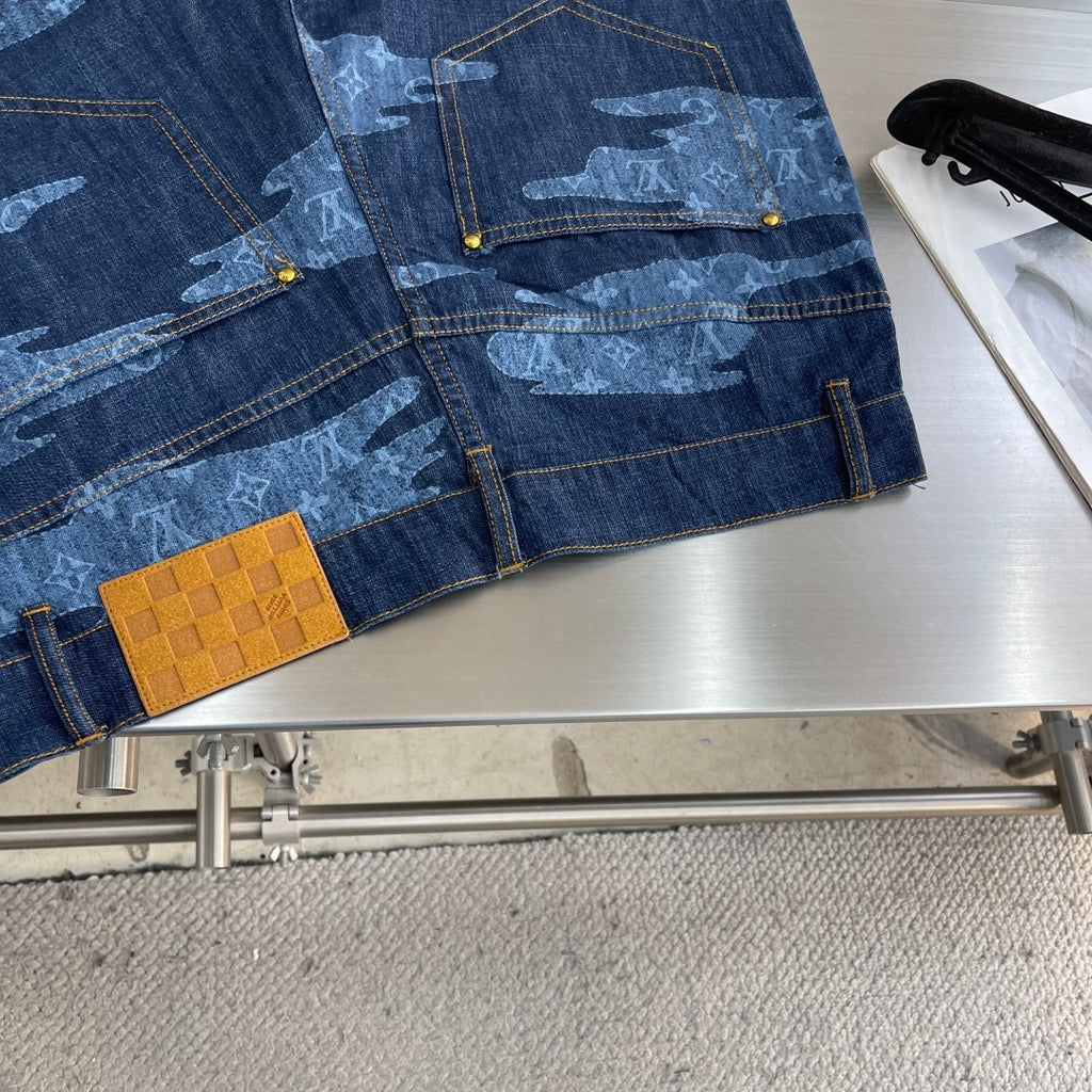 Louis Vuitton dark blue denim shorts with light blue patterned panels and gold-tone buttons