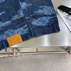 Louis Vuitton dark blue denim shorts with light blue patterned panels and gold-tone buttons