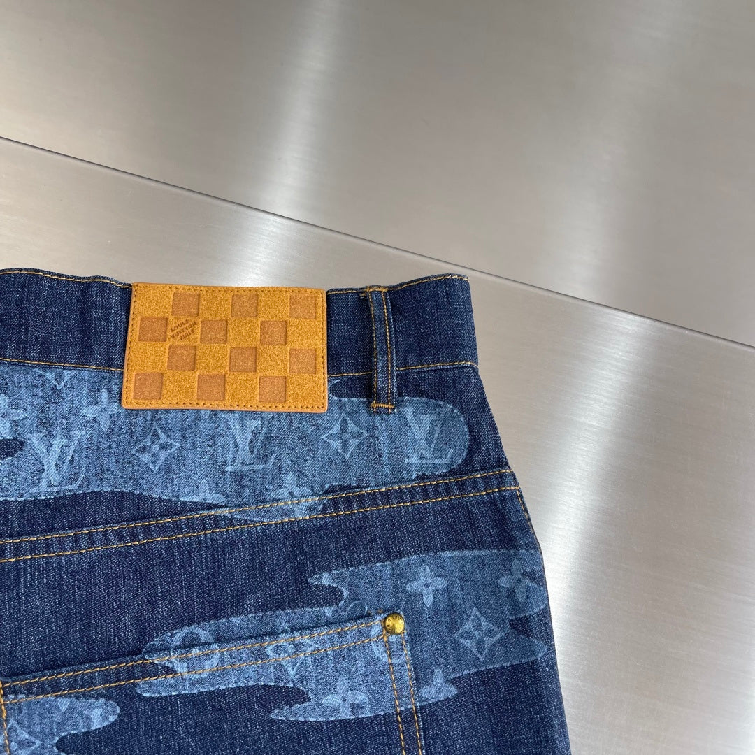Louis Vuitton dark blue denim shorts waistband with tan logo patch and belt loops