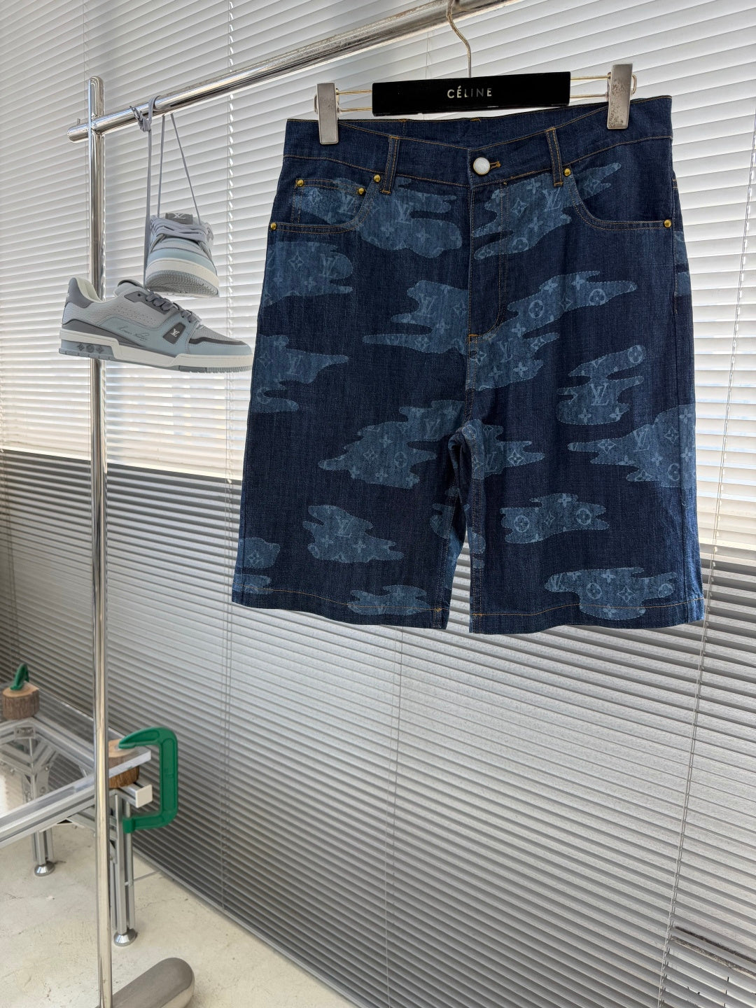 Louis Vuitton dark blue denim shorts with light blue all-over patterned print