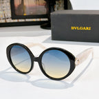 Black sunglasses with gradient blue lenses, BVLGARI logo on temple arms