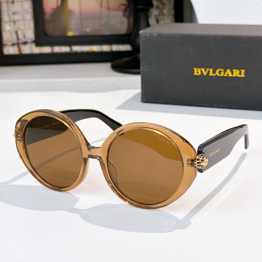 Gold-tone sunglasses with amber tinted lenses, BVLGARI logo on temple