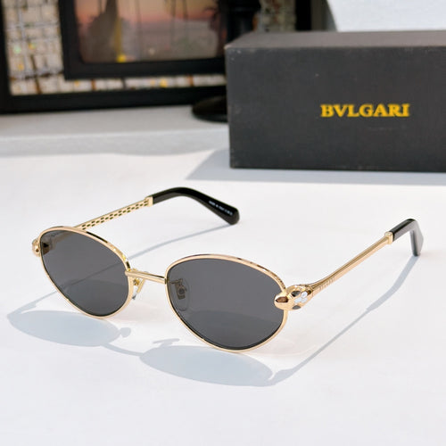 Gold-rim round sunglasses with dark lenses and black-tipped temples