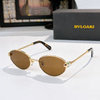Gold-rim round sunglasses with brown lenses and tortoise temple tips