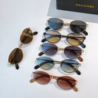 Group of round sunglasses in multiple colors with tinted lenses
