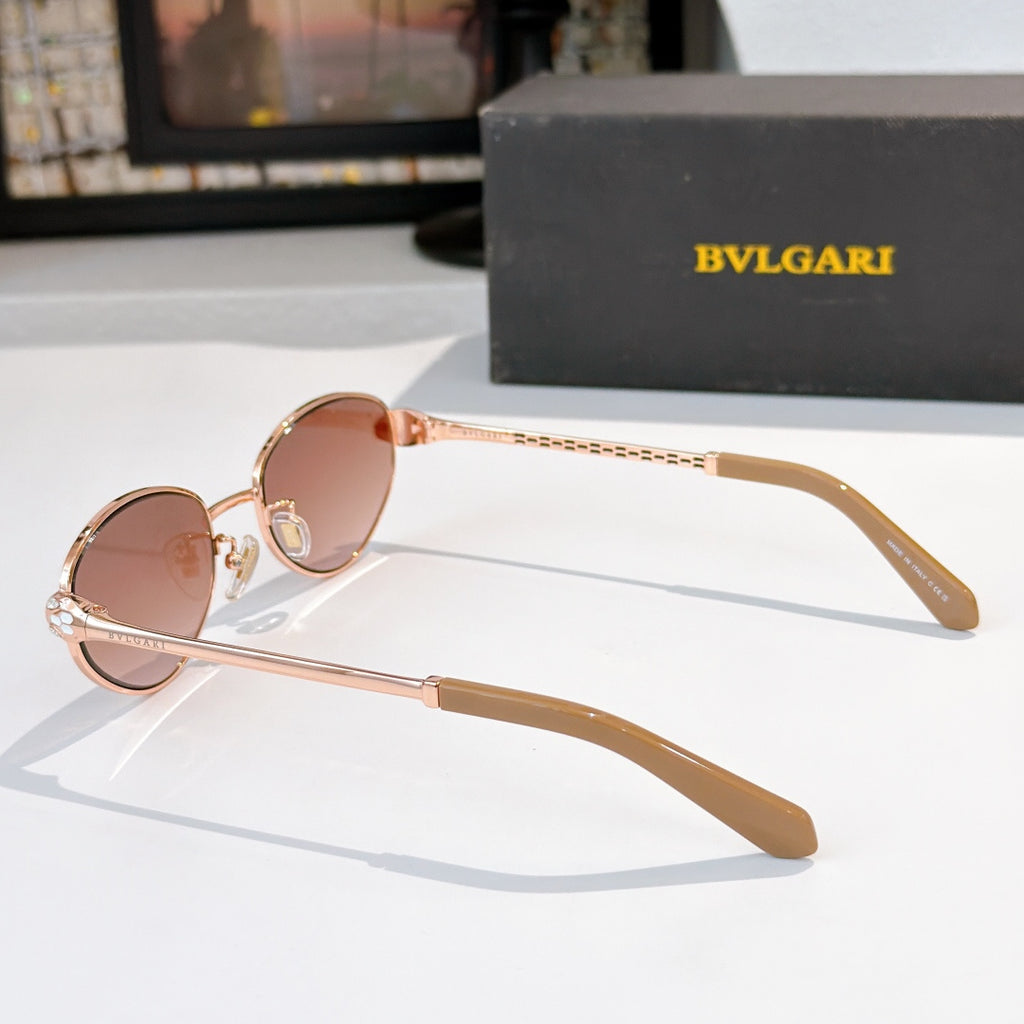 Rose-gold round sunglasses with pink-tinted lenses and long straight temples