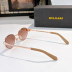 Rose-gold round sunglasses with pink-tinted lenses and long straight temples
