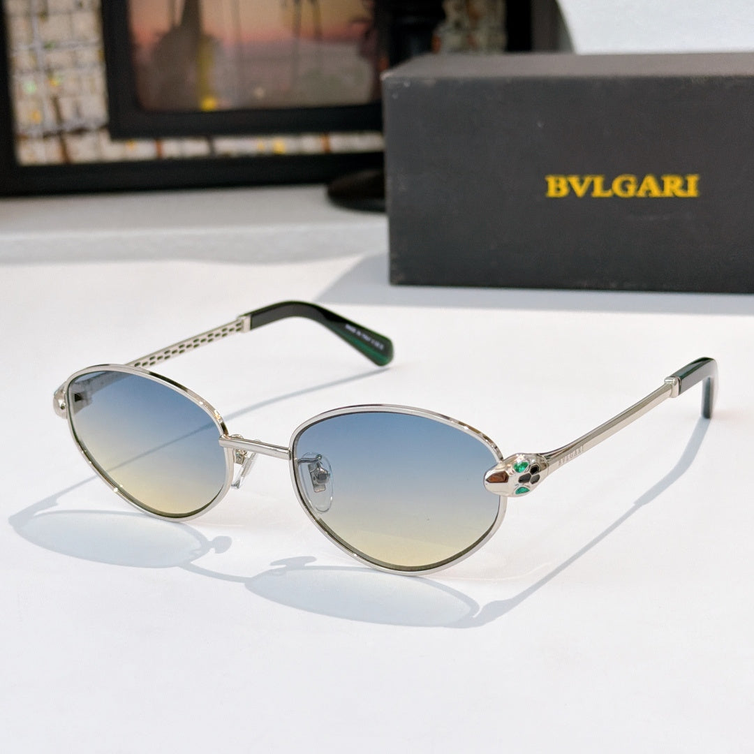 Round sunglasses with blue-to-gold gradient lenses and thin metal frame