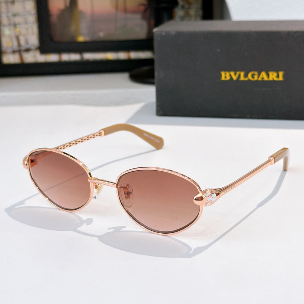 Rose-gold round sunglasses with pink lenses and warm brown temple tips