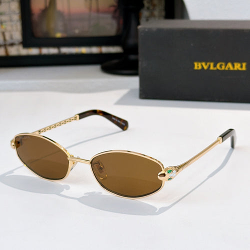 Sunglasses with gold frame, tortoise accents, and amber tinted lenses