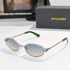 Sunglasses with silver frame, green temple tips, and light blue tinted lenses