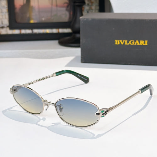 Sunglasses with silver frame, green temple tips, and light blue tinted lenses